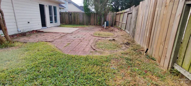 a view of a backyard of the house