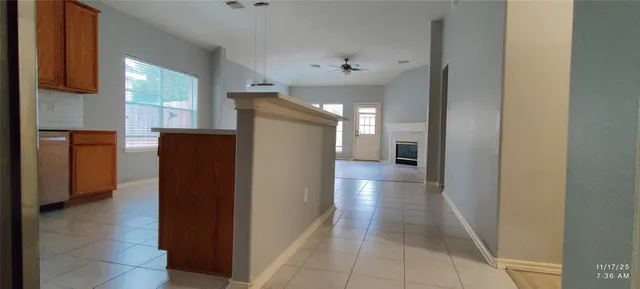 a view of hallway with furniture and a window