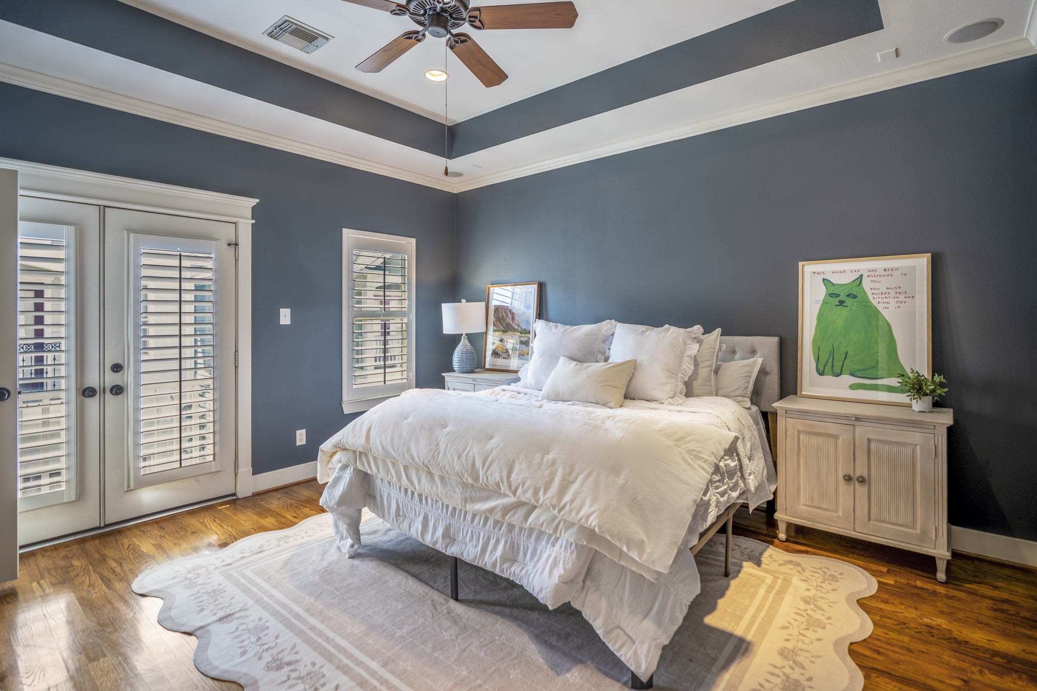 905 West 23rd Street Houston, TX 77008 - Photo 32 of 46 Spacious primary retreat featuring tray ceilings and French doors opening to a private balcony.