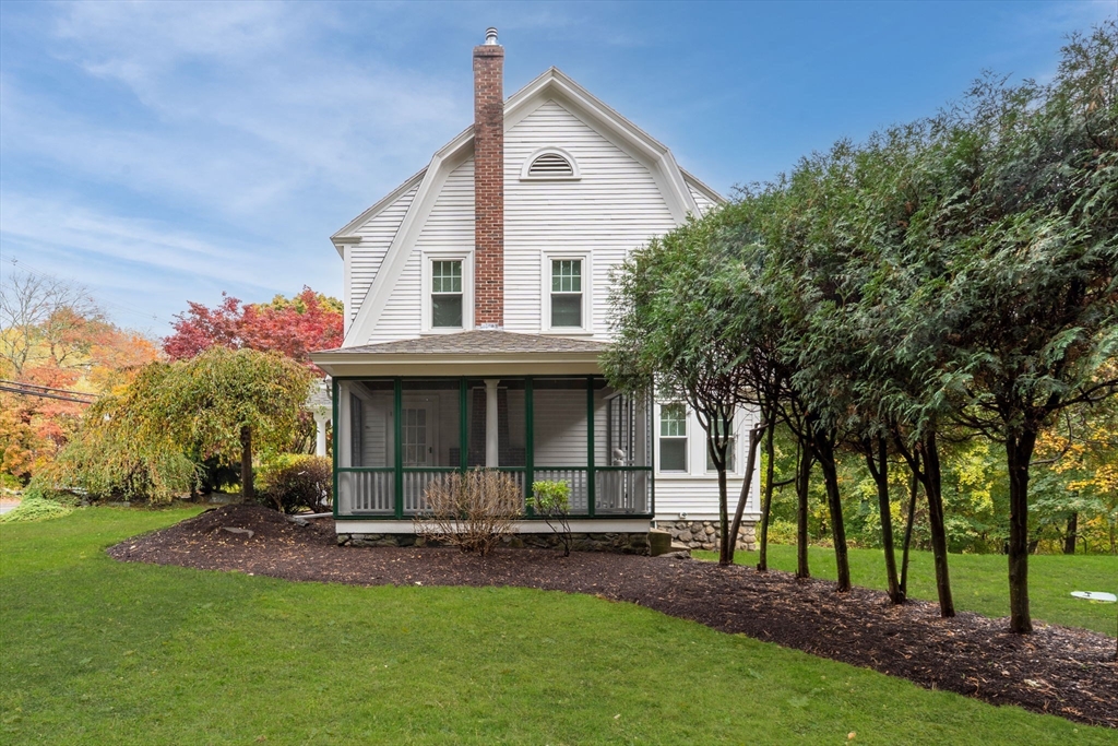424 Great Road Stow, MA 01775 - Photo 3 of 41 a view of a house with a yard and sitting area
