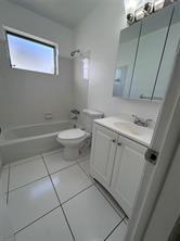 3614 Taylor Street Hollywood, FL 33021 - Photo 13 of 20 a bathroom with a sink a toilet and shower