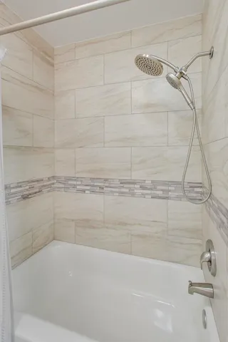 a close up of a bathtub in a bathroom