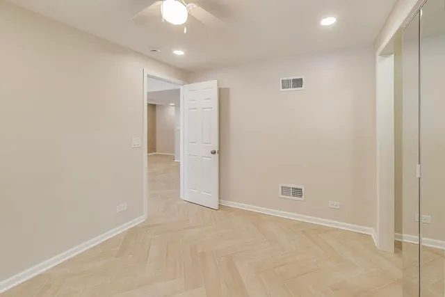 an empty room with closet area