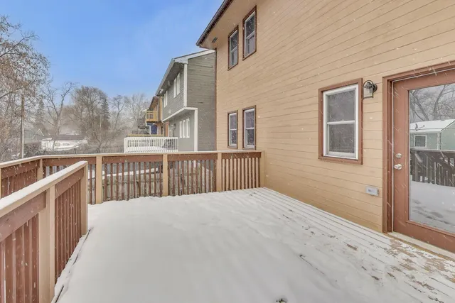 a view of a house with a wooden fence