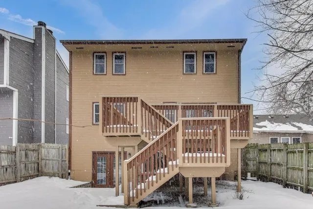 a front view of a house with iron fence