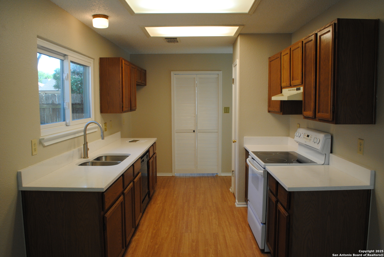 5955 Spring Crossing San Antonio, TX 78247 - Photo 6 of 17 a bathroom with a sink double vanity granite and a mirror