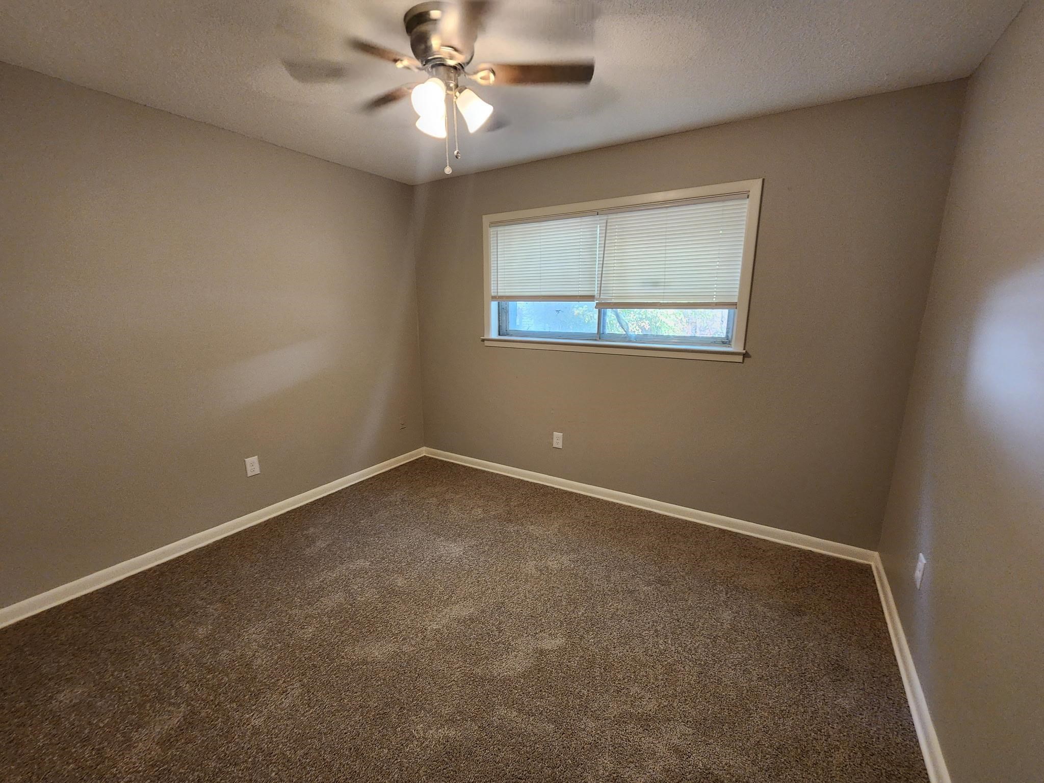 3446 Fox Meadows Road Memphis, TN 38115 - Photo 20 of 22 an empty room with a window