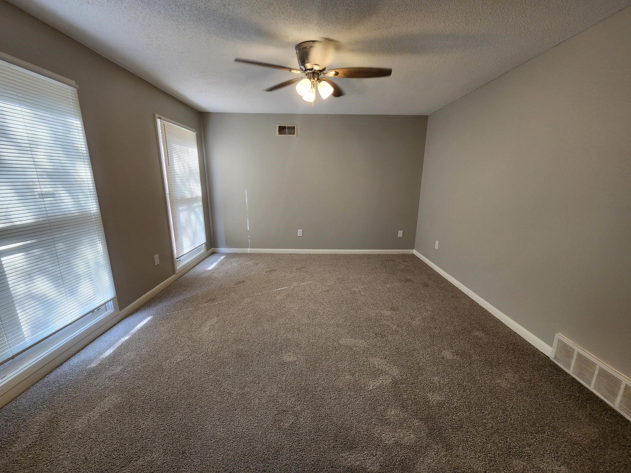 3446 Fox Meadows Road Memphis, TN 38115 - Photo 7 of 22 a view of an empty room with a window
