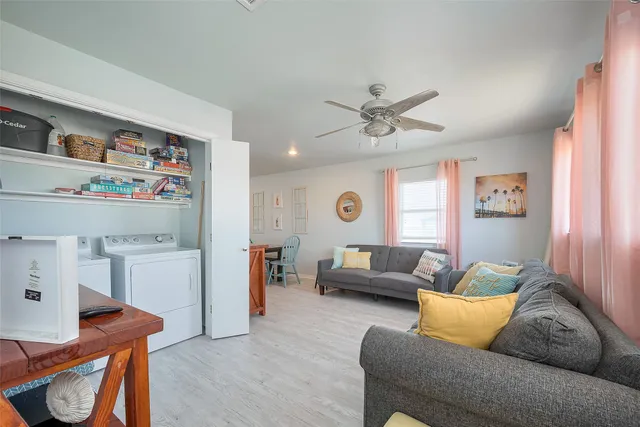 a living room with furniture and a window