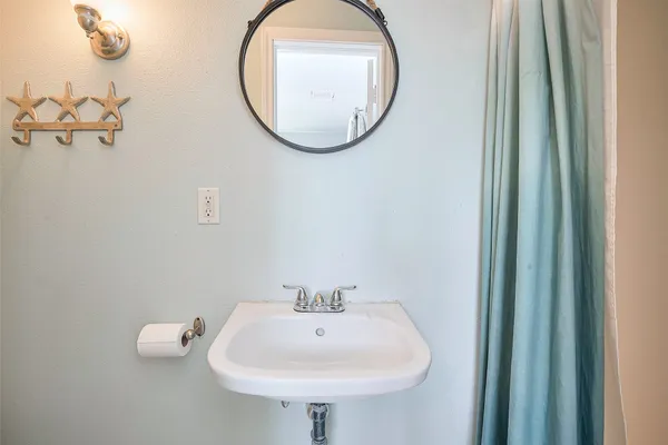 a bathroom with a sink and a mirror