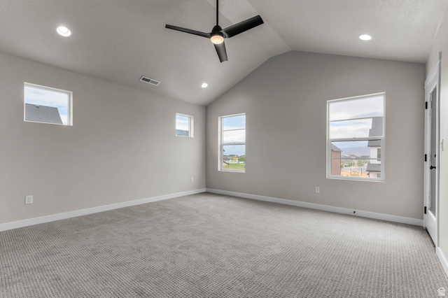 1567 North 3250 West Provo, UT 84601 - Photo 14 of 22 Vaulted ceiling room with recessed lighting, ceiling fan, multiple windows, and neutral carpeting