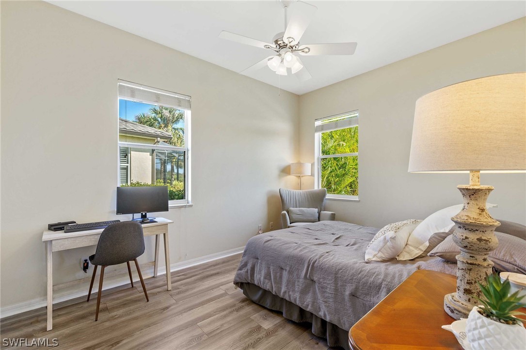 12934 Timber Ridge Drive Fort Myers, FL 33913 - Photo 15 of 24 a bedroom with a bed and a chair