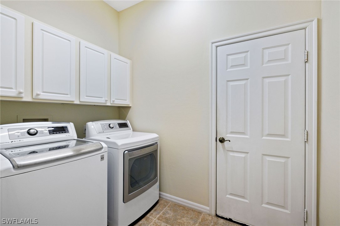 12934 Timber Ridge Drive Fort Myers, FL 33913 - Photo 17 of 24 a view of storage and utility room with washer and dryer