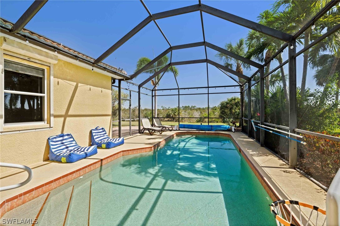 12934 Timber Ridge Drive Fort Myers, FL 33913 - Photo 20 of 24 a view of swimming pool with seating area