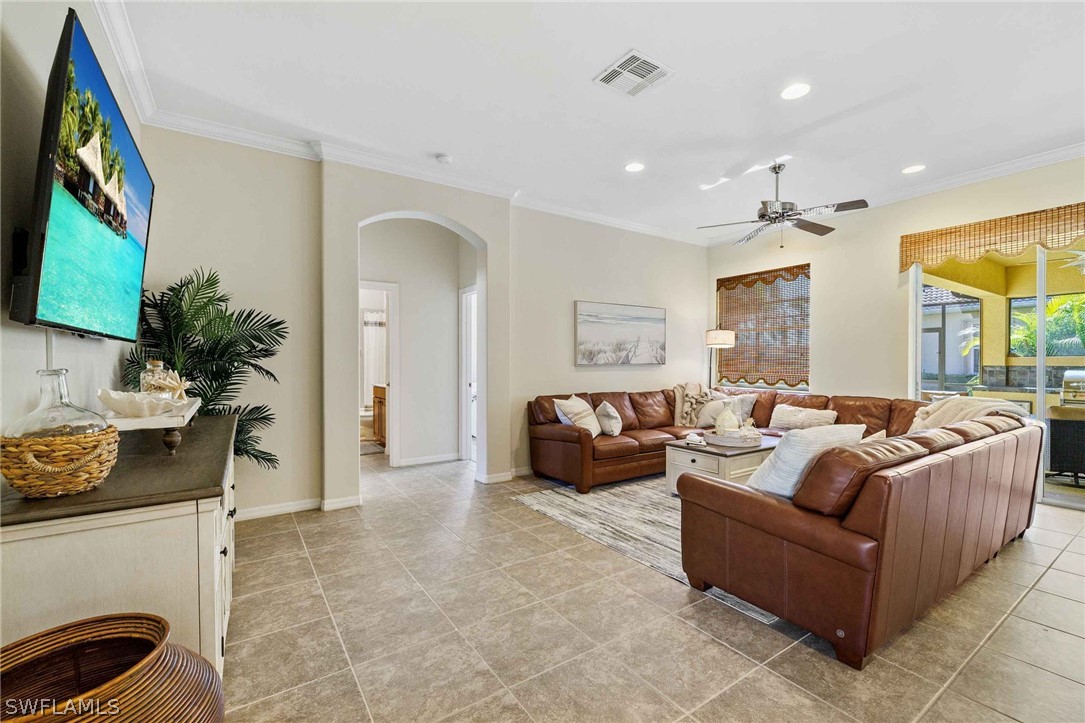 12934 Timber Ridge Drive Fort Myers, FL 33913 - Photo 5 of 24 a living room with furniture and a flat screen tv