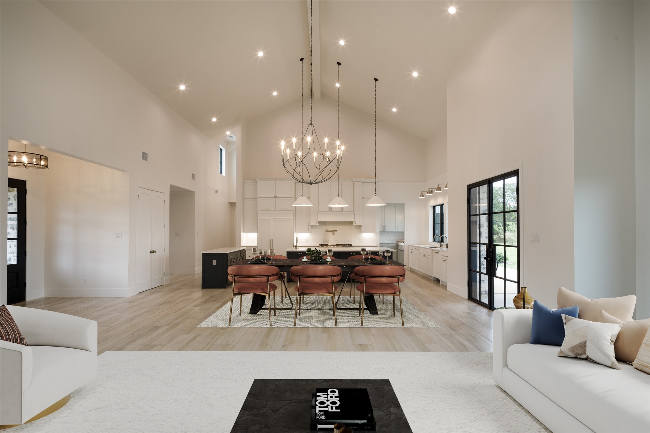 24118 Margerstadt Road Hockley, TX 77447 - Photo 15 of 46 Wide gathering spaces and elevated ceiling heights allow the main living areas to feel expansive without losing warmth or livability. Positioned at the center of the home, the layout supports both large gatherings and quieter everyday use.