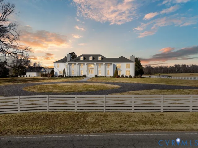a view of a swimming pool with an outdoor space and seating area