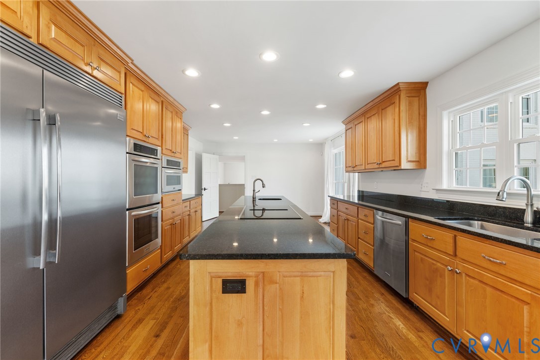 189 Old Buckingham Road Cumberland, VA 23040 - Photo 18 of 50 a kitchen with stainless steel appliances granite countertop a sink and a refrigerator