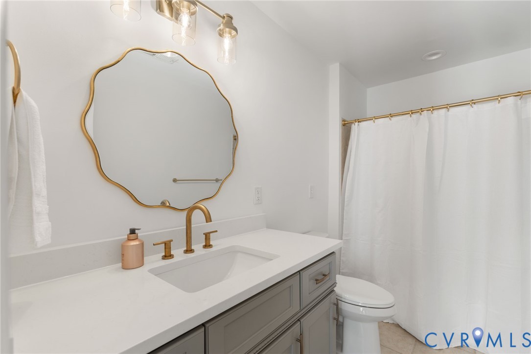 189 Old Buckingham Road Cumberland, VA 23040 - Photo 25 of 50 a bathroom with a sink and a mirror