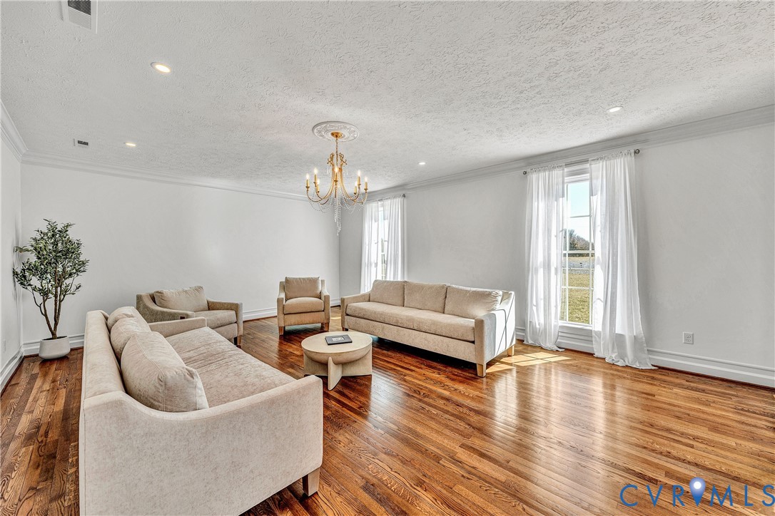 189 Old Buckingham Road Cumberland, VA 23040 - Photo 8 of 50 a living room with furniture and wooden floor