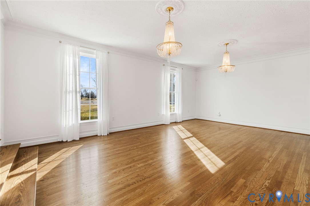 189 Old Buckingham Road Cumberland, VA 23040 - Photo 9 of 50 a view of empty room with wooden floor and fan