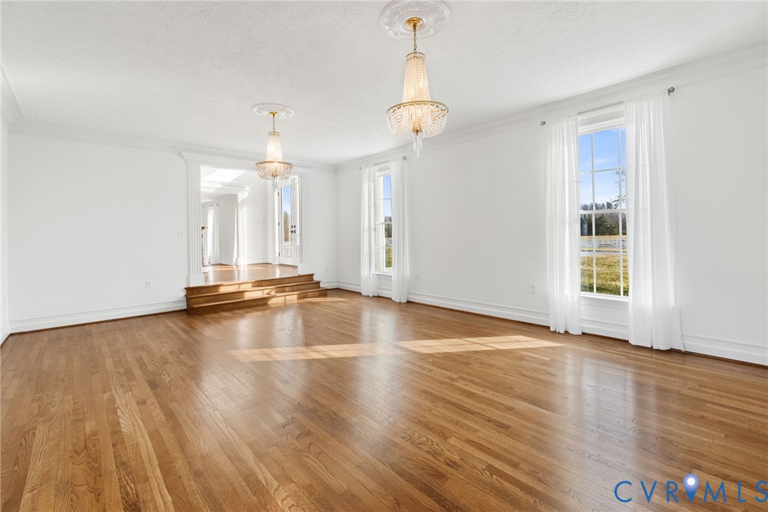 189 Old Buckingham Road Cumberland, VA 23040 - Photo 10 of 50 a view of empty room with wooden floor and window