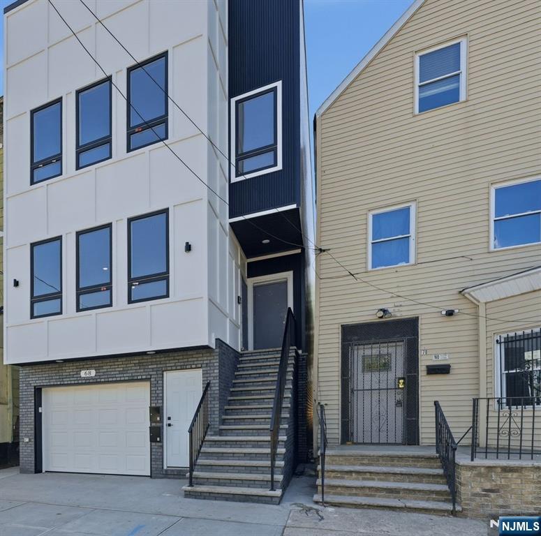 68 Sherman Avenue Newark, NJ 07114 - Photo 2 of 37 a building with a window and balcony