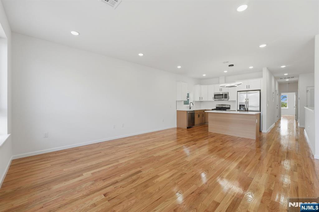 68 Sherman Avenue Newark, NJ 07114 - Photo 26 of 37 a view of kitchen with wooden floor