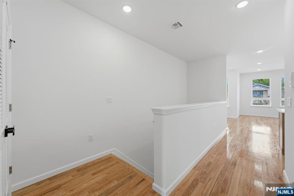68 Sherman Avenue Newark, NJ 07114 - Photo 27 of 37 a view of empty room with wooden floor