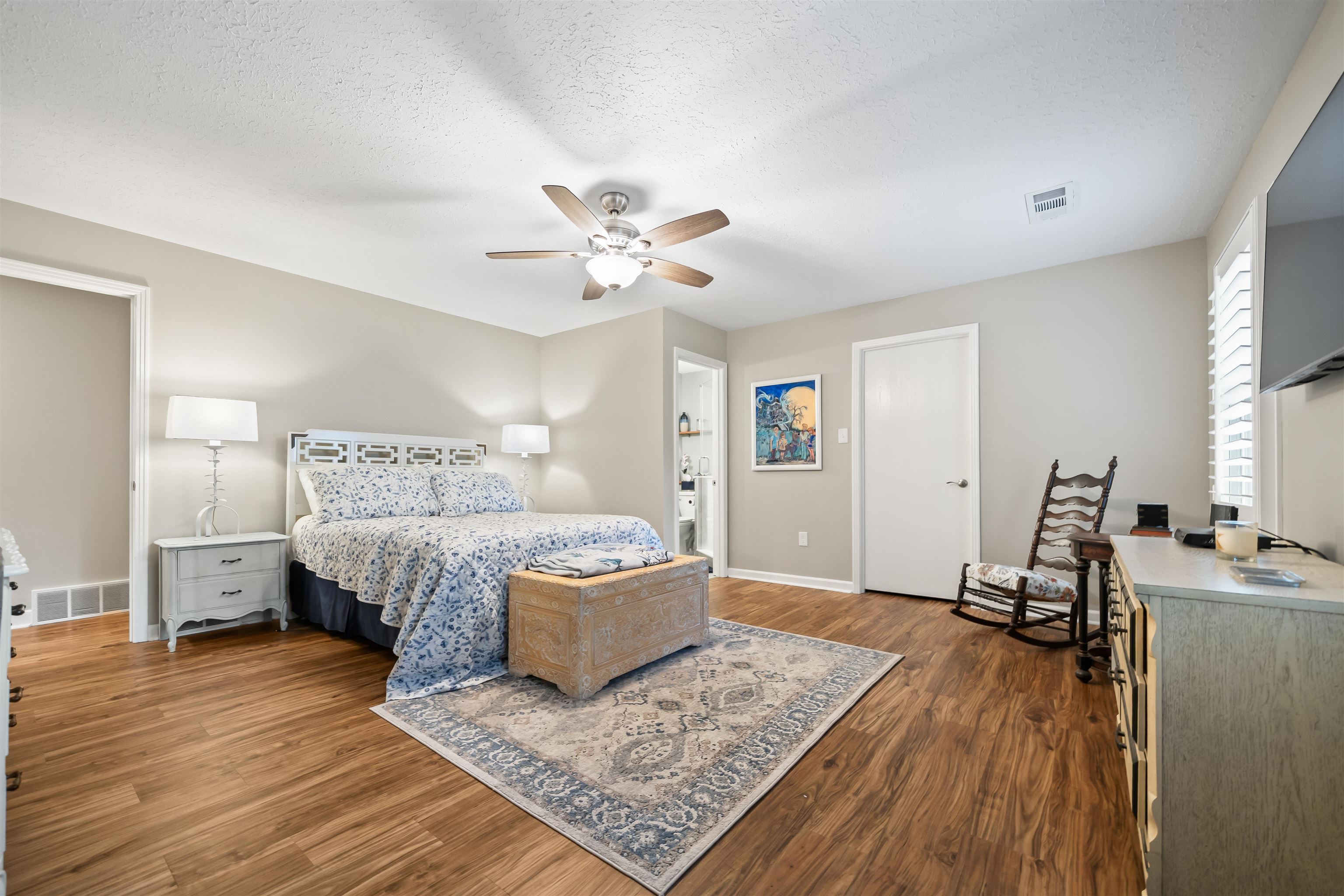 6943 Fords Station Road, Unit 64 Germantown, TN 38138 - Photo 29 of 30 Spacious room featuring wood-finish flooring, a ceiling fan, and white plantation shutters