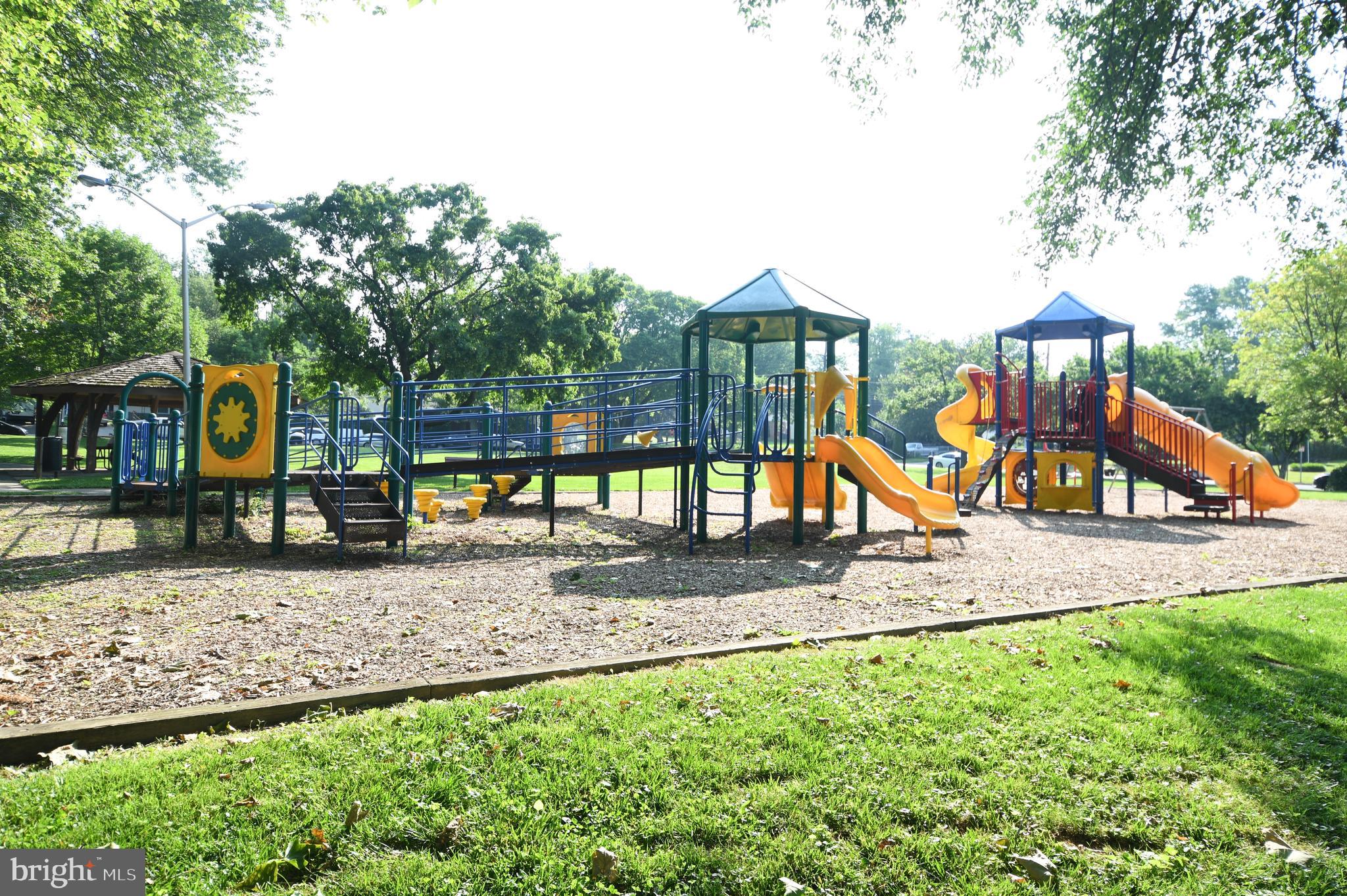 111 Spring Street Gaithersburg, MD 20877 - Photo 8 of 11 a view of a park with swings and slides