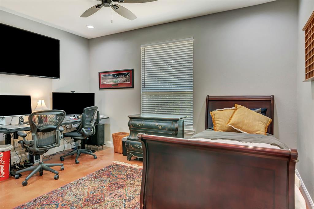 129 Whiskey Rnch Road Runaway Bay, TX 76426 - Photo 27 of 39 a bedroom with a workspace