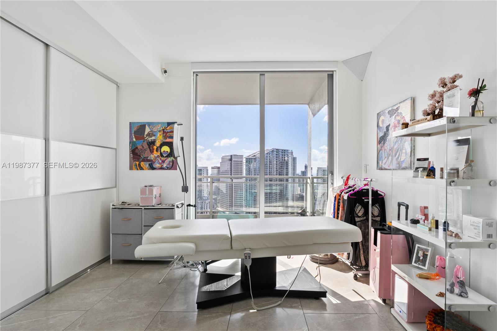 90 Southwest 3rd Street, Unit 4301 Miami, FL 33130 - Photo 15 of 18 a living room with furniture and a floor to ceiling window