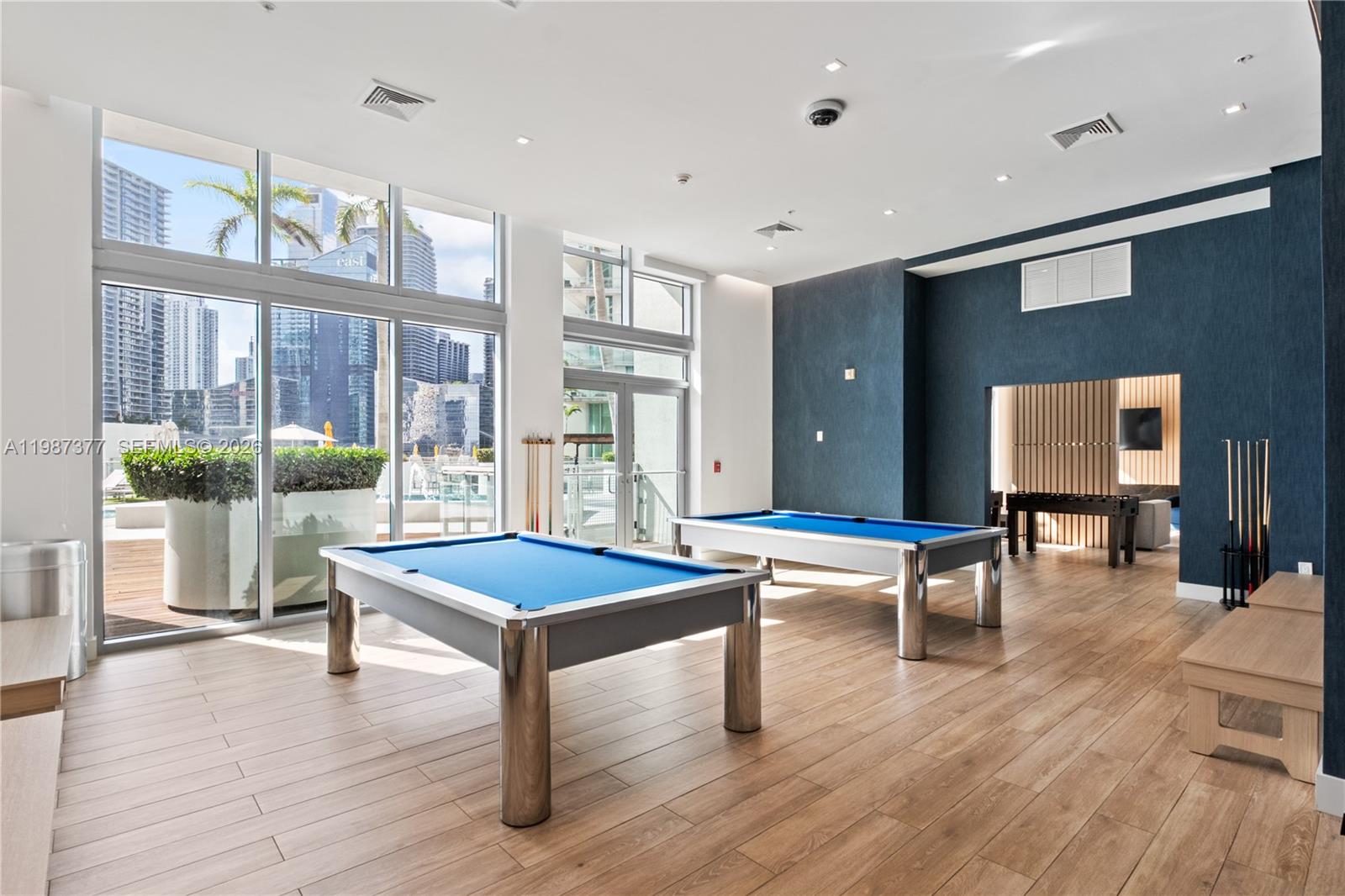 90 Southwest 3rd Street, Unit 4301 Miami, FL 33130 - Photo 3 of 18 a living room with furniture a table and wooden floor