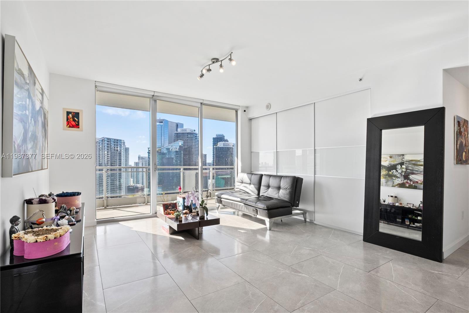 90 Southwest 3rd Street, Unit 4301 Miami, FL 33130 - Photo 4 of 18 a view of a livingroom with furniture and a large window