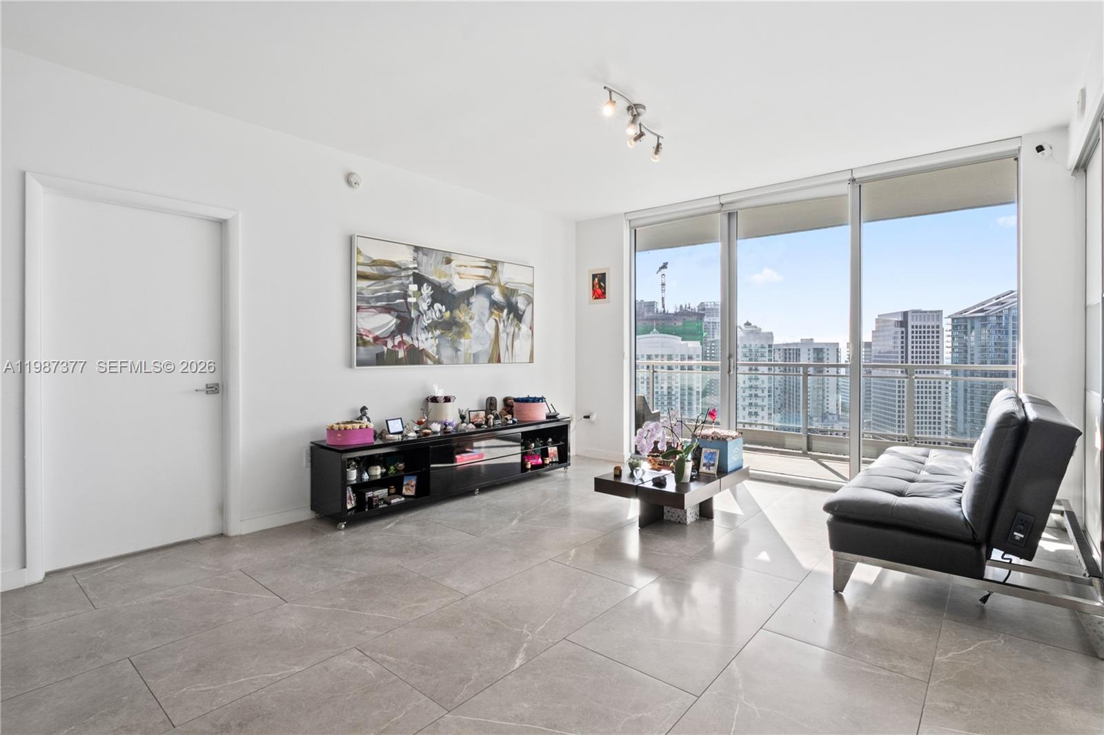 90 Southwest 3rd Street, Unit 4301 Miami, FL 33130 - Photo 5 of 18 a living room with furniture and floor to ceiling window