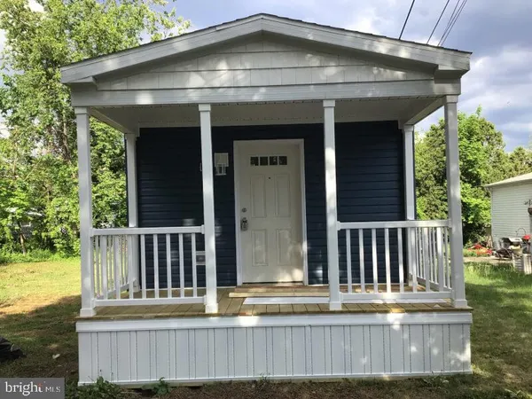 a view of a house with wooden deck