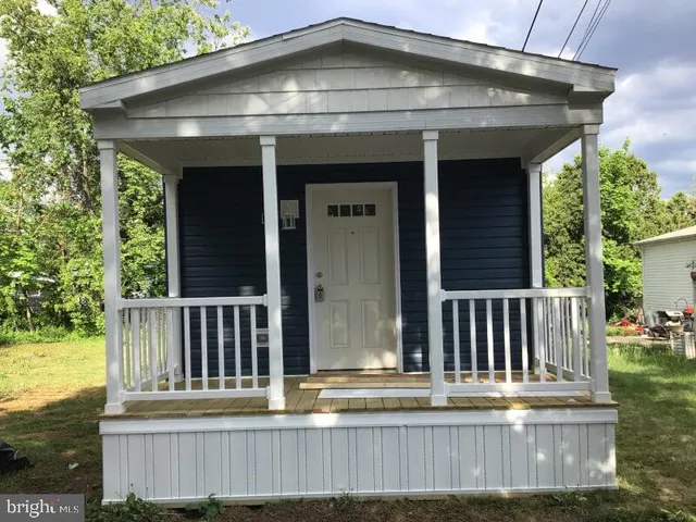 a view of a house with wooden deck