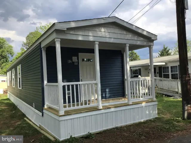 a front view of a house with a porch