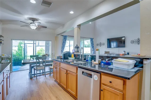 a bedroom with furniture and a large window
