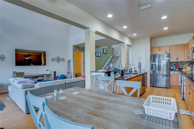 a white toilet sitting next to a white wall