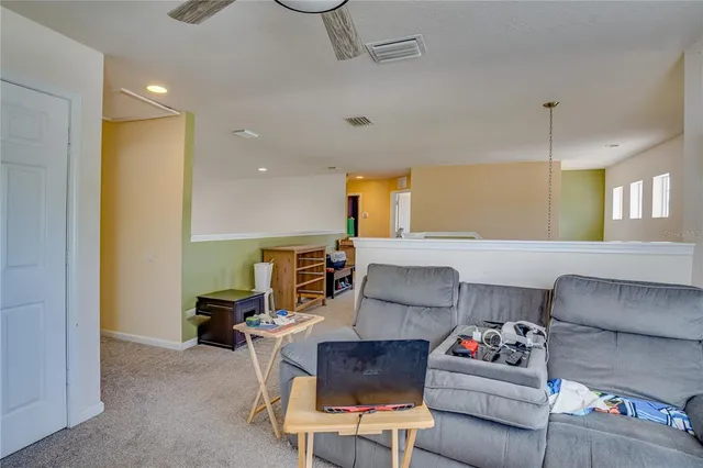 a room that has a bed and a chair in it