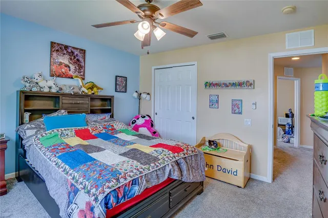 a utility room with dryer washer and a view of living area