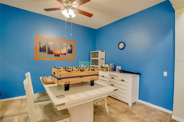 a kitchen with lots of counter top space and furniture