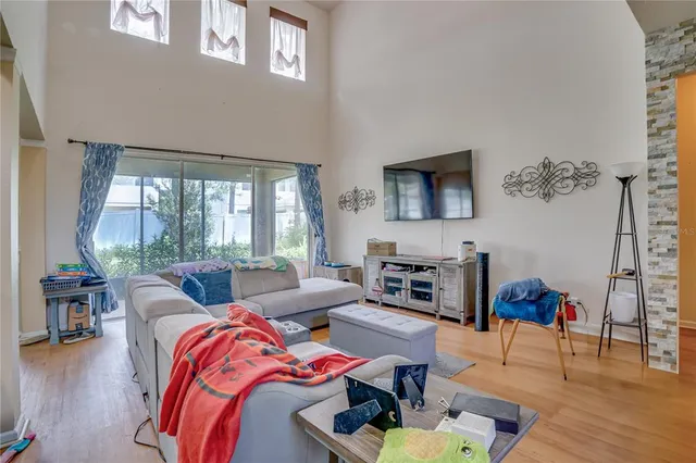 a view of a livingroom with furniture and a large window