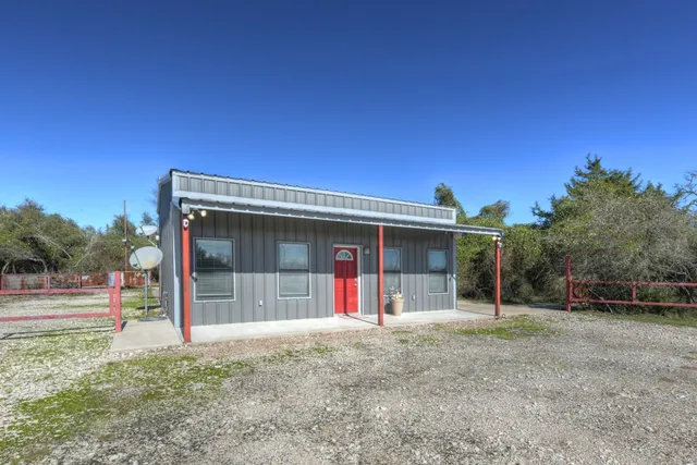 a kitchen with stainless steel appliances granite countertop a stove and a refrigerator