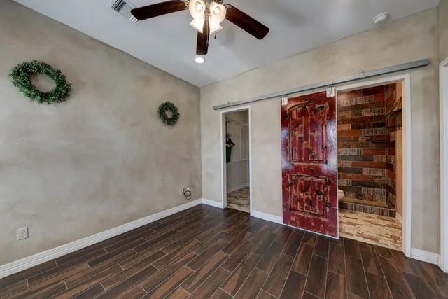 a view of a swimming pool with a yard