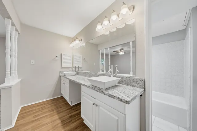 a bathroom with a toilet a sink and bathtub