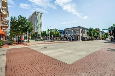 a view of street with tall buildings