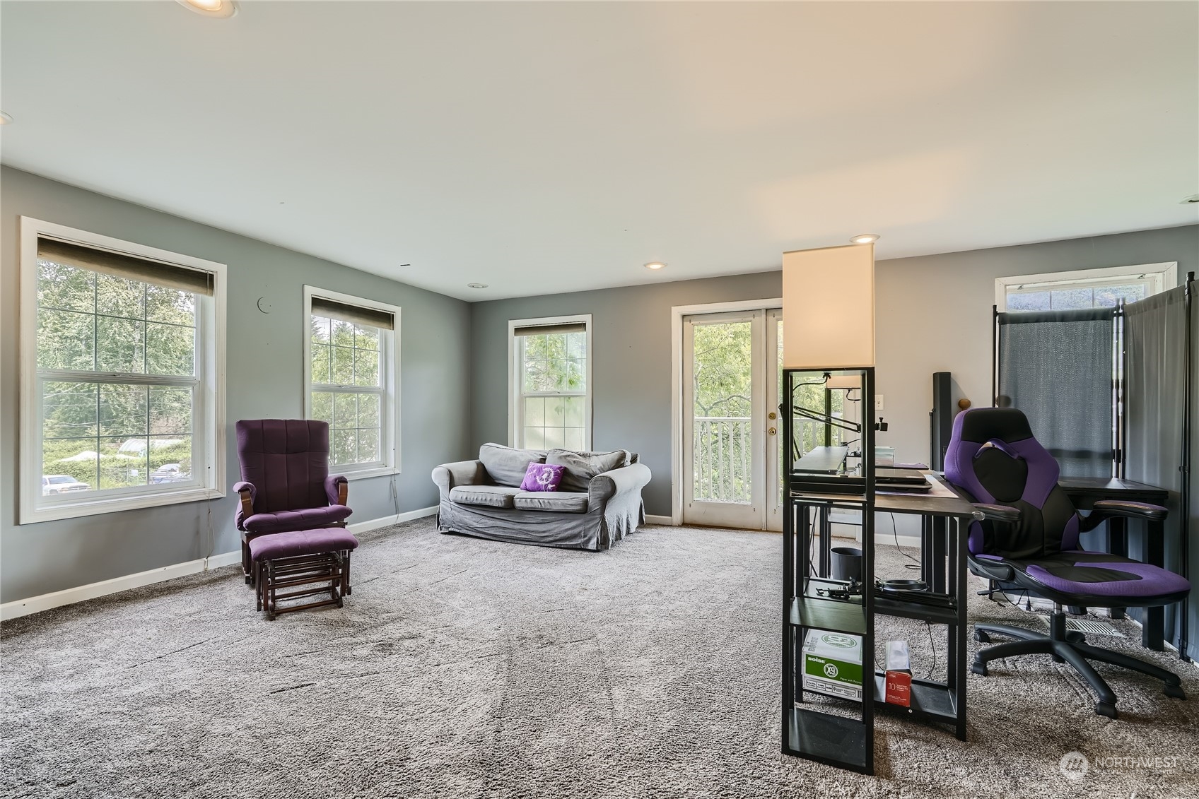 6935 24th Avenue Southwest Seattle, WA 98106 - Photo 11 of 27 a living room with furniture and a window